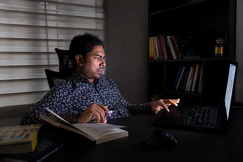 Qadaruddin Shishir at work in The Dissent’s modest office in Dhaka