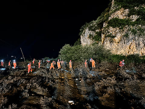 Rescue workers carry out search and rescue operations following flash floods at a scenic area in Weiyuan county, Dingxi city, Gansu province, China July 26, 2026.