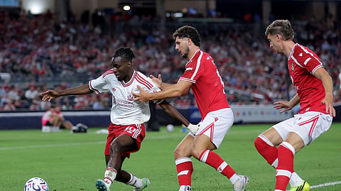 Liverpool FC defender Jeremie Frimpong (30) controls the ball against Wrexham AFC defender Lewis Brunt (3) and defender Liberato Cacace (13) during the second half at Yankee Stadium in New York on July 29, 2026.