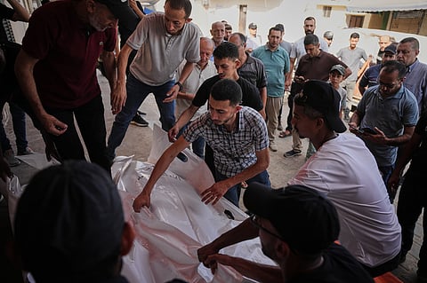 Mourners carry the bodies of Kamal Abu Muailiq, 68, and his wife, Huda Abu Muailiq, 59, who were killed in an Israeli airstrike, during their funeral in Deir al-Balah, Gaza Strip, Sunday, Aug 2, 2026.