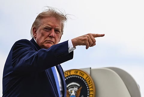 U.S. President Donald Trump points a finger as he boards Air Force One at Morristown Municipal Airport in Morristown, New Jersey, U.S., August 2, 2026. 