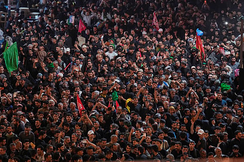 Shiite worshippers gather between the holy shrines of Imam Hussein and Imam Abbas, ahead of Arbaeen, the annual Shiite commemoration marking 40 days after Ashoura, at the Imam Hussein Shrine in Karbala, Iraq, Monday, Aug 3, 2026. 