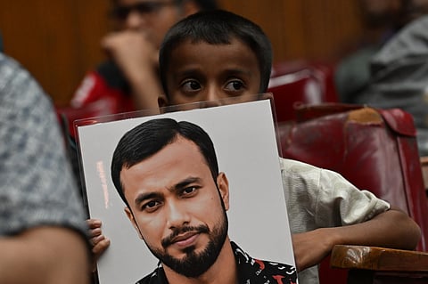 Miraj Sheikh’s family member was holding the placard at a program on August 29