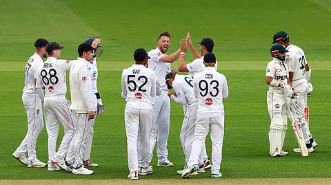 England’s Ollie Robinson celebrates with teammates after dismissing Pakistan’s Shan Masood during the second Test at Lord’s.