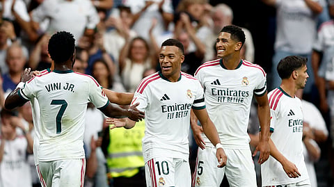 Real Madrid’s Jude Bellingham celebrates after scoring the opening goal against Malaga with Kylian Mbappe, Brahim Diaz and Vinicius Junior.