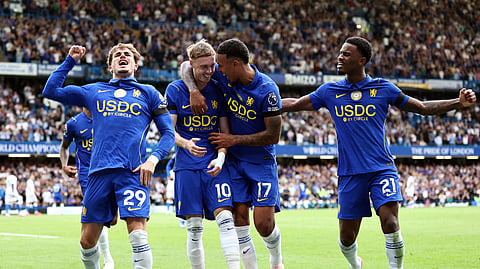 Cole Palmer celebrates with teammates after scoring Chelsea’s fourth goal against Brighton & Hove Albion.