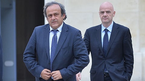 Former UEFA president Michel Platini (L), FIFA president Gianni Infantino.