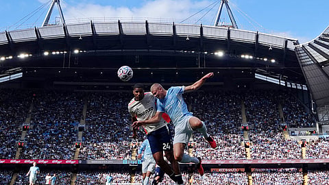 Manchester City's Erling Haaland in action with Coventry City's Aurele Amenda.