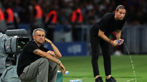 Paris St Germain coach Luis Enrique looks on alongside AS Monaco coach Filipe Luis.