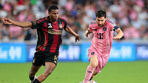 Inter Miami CF forward Lionel Messi (10) dribbles the ball against Atlanta United midfielder Mauricio Amaro (14) during the second half at Nu Stadium.