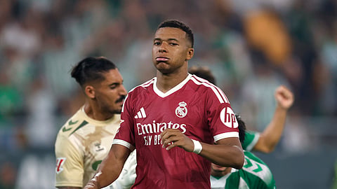 Kylian Mbappe looks dejected after his penalty is saved by Real Betis goalkeeper Alvaro Valles.