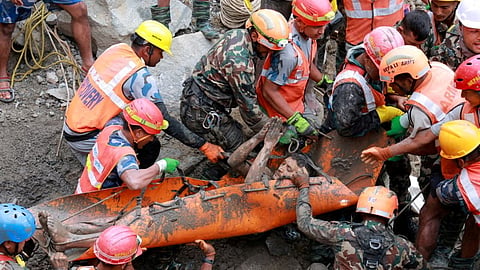 Survivor Kabir Maharjan is carried by members of a search and rescue team after they rescued two people alive who had been trapped inside a tunnel following devastating floods and mudslides that struck the Bhotekoshi River in Rasuwa, Nepal, September 4, 2026.