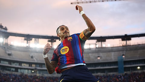 FC Barcelona's Raphinha celebrates after scoring his side's third goal.