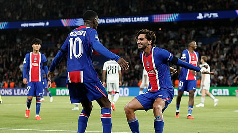 Ferran Torres celebrates completing his hat-trick with Ousmane Dembele during Paris St Germain's win over Slovan Bratislava.