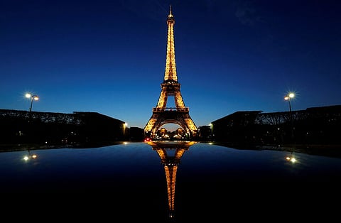A night view shows the Eiffel tower, reflected in a car's roof, in Paris, France, April 30, 2016. 