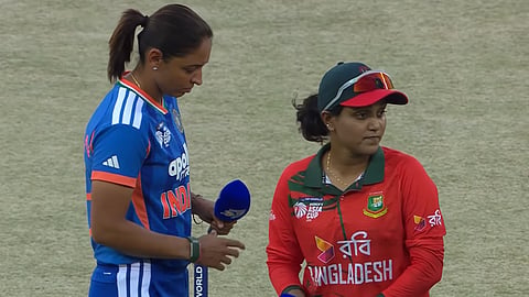 Bangladesh captain Nigar Sultana (R), India captain Harmanpreet Kaur at the toss ahead of the Women's Asia Cup semifinal match in Dubai on Thursday.