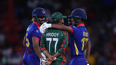 Nepal’s Rohit Paudel interacts with Bangladesh’s Towhid Hridoy during the ICC Men’s T20 World Cup 2024.