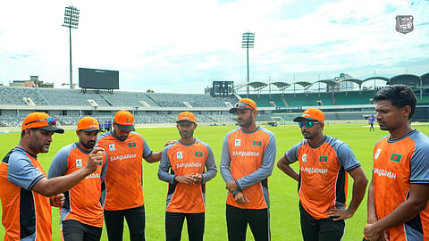 Bangladesh Asian Games men's cricket team coach Mohammad Salahuddin (L) speaks before the practice session at the Sher-e-Bangla National Cricket Stadium in Mirpur on Sunday.