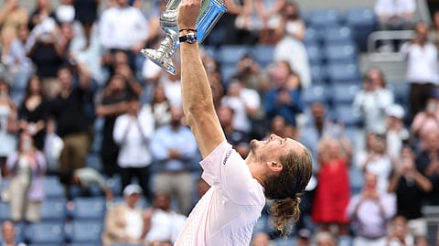 Germany's Alexander Zverev celebrates with the trophy after winning the men's singles final.