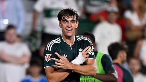 Real Madrid's Carlos Espi celebrates after scoring the winning goal against Elche.