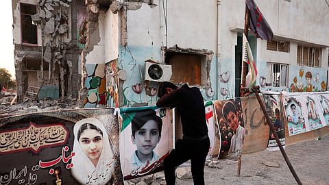Masoud, an Iranian man who lost his son Mohammad Taha in the Minab school strike on February 28, reacts at the school in Minab, Iran, August 27, 2026.