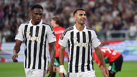 Juventus' Zeki Celik (R) celebrates scoring their fourth goal.