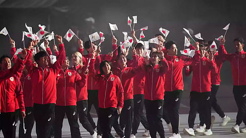 Athletes march into the stadium during the opening ceremony for the Asian Games in Nagoya, Japan, Saturday, Sept. 19, 2026. 