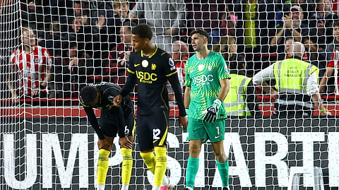 Chelsea's Levi Colwill, Emiliano Martinez and Mahdi Nicoll-Jazuli look dejected after Brentford's Fabio Carvalho scores their third goal.