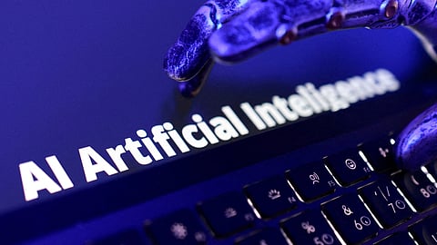 The words "AI Artificial Intelligence," a keyboard and a robotic hand are shown in this illustration created on June 5, 2026.