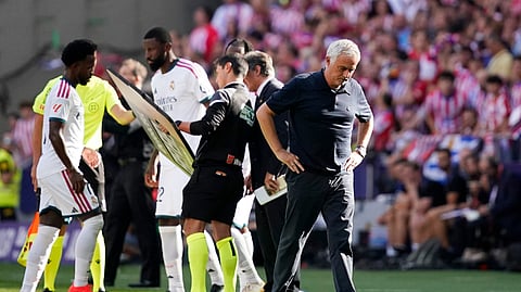 Real Madrid coach Jose Mourinho looks dejected after Real Madrid's Dean Huijsen is shown a red card by referee Miguel Angel Ortiz Arias.