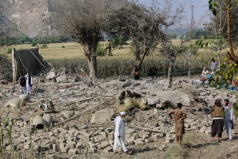 Residents inspect the rubble of a house destroyed in a strike in Patan village, Kunar province, eastern Afghanistan, Monday, Sept 21, 2026.