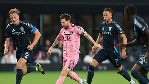 Inter Miami CF forward Lionel Messi (10) dribbles the ball against San Diego FC midfielder Jeppe Tverskov (6) and forward Marcus Ingvartsen (7) during the first half at Miami Freedom Park.