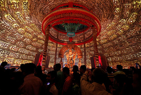 People visit a temporary platform called pandal during the Hindu religious festival Durga Puja in Kolkata, September 29, 2017