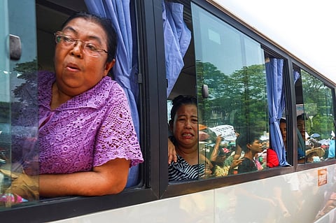Prisoners on a bus react as they are released from Insein Prison as part of an amnesty to mark Myanmar New Year in Yangon, Myanmar, on April 17.