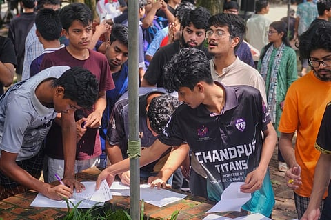 CUET students take part in a mass signature campaign at the university’s Shaheed Minar premises on Wednesday.