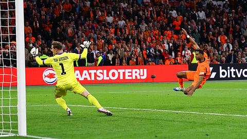 Cody Gakpo scores the equaliser with a volley for the Netherlands against Germany.