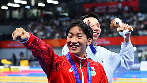 Gold medallist Japan's Shin Ohashi celebrates after winning the Men's 200m Breaststroke.