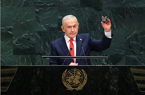 Netanyahu holds up a pager during his UN address, September 24, 2026.