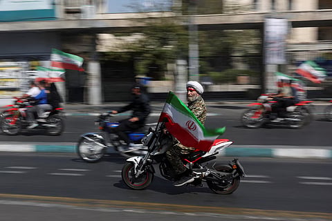An Iranian cleric rides on a motorcycle as he participates in a march in Tehran, Iran, September 25, 2026