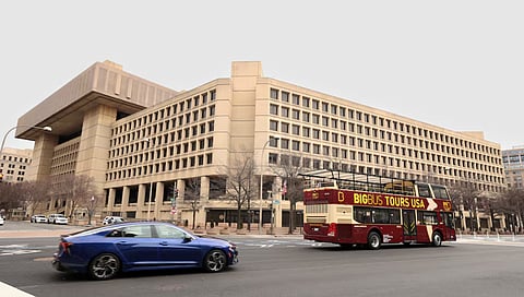 A tour bus drives past the FBI headquarters in Washington, U.S., February 3, 2025. 