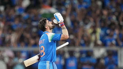 Virat Kohli celebrates after reaching his 55th ODI century and completing 15,000 runs in the format.