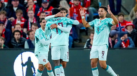 Joao Felix celebrates scoring Portugal’s opener with Nuno Mendes and Goncalo Ramos against Norway.