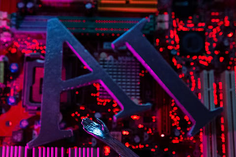 AI (Artificial Intelligence) letters and robot hand are placed on computer motherboard in this illustration taken, June 23, 2023.