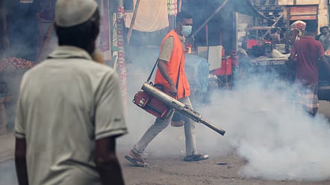 A man fumigates a road as a preventive measure against mosquito-borne diseases, particularly dengue, in Dhaka, Bangladesh, October 1, 2026. 