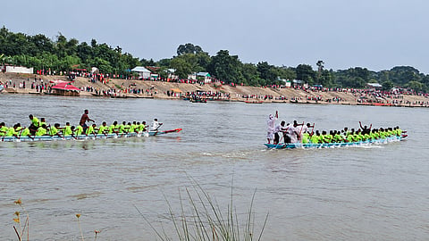 Boat-racing teams power across the Brahmaputra river in a tightly contested race