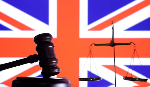 The British flag, a judge gavel and a vintage scale are seen in this illustration taken August 6, 2024