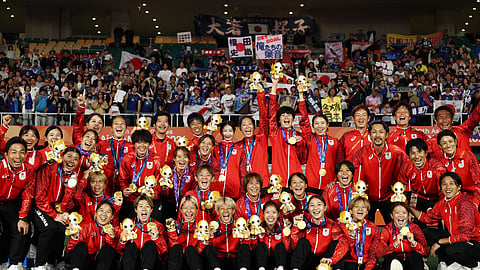 Gold medallists Japan celebrate after the victory ceremony.
