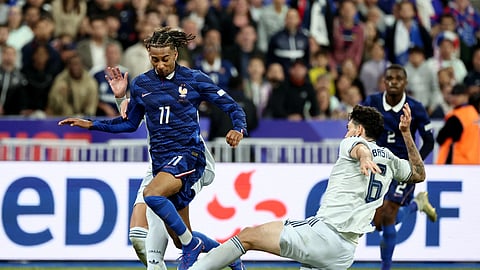 France's Michael Olise in action against Italy's Alessandro Bastoni during their Nations League Group A1 match