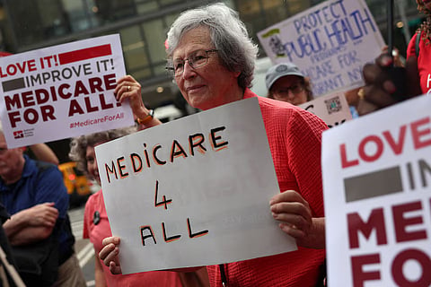 People participate in a rally on the 61st Anniversary of Medicare and Medicaid, across from Bellevue Hospital in New York City, US, July 30, 2026