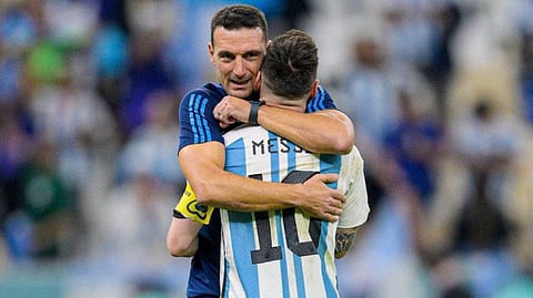 Argentina head coach Lionel Scaloni embraces Lionel Messi.